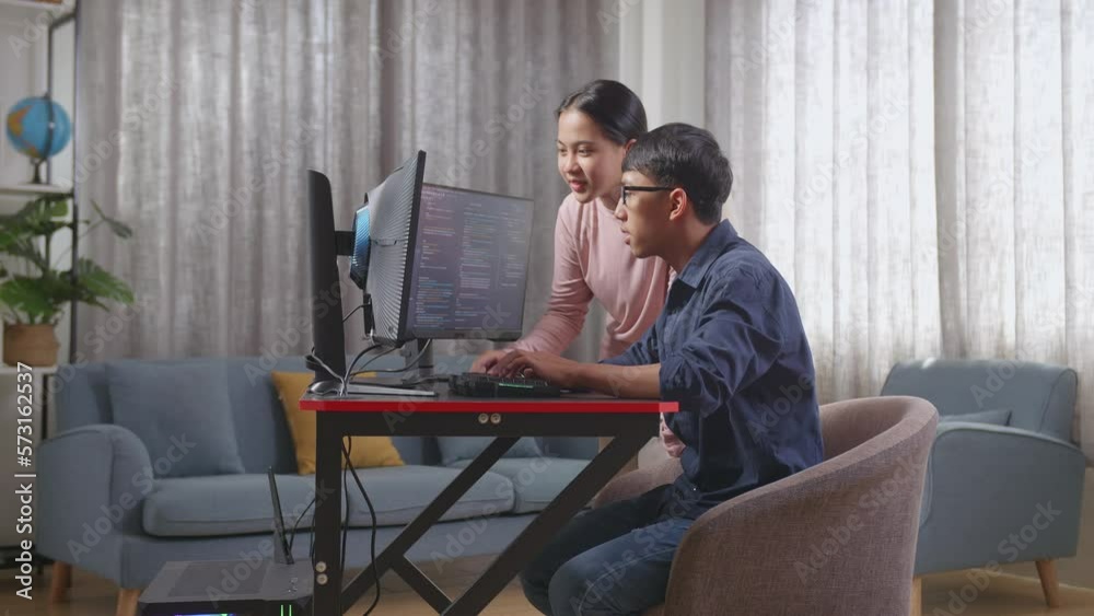 Asian Teen Boy Students Studying Software Code From His Sister
Asian Teen Boy Students Studying Software Code From His Sister