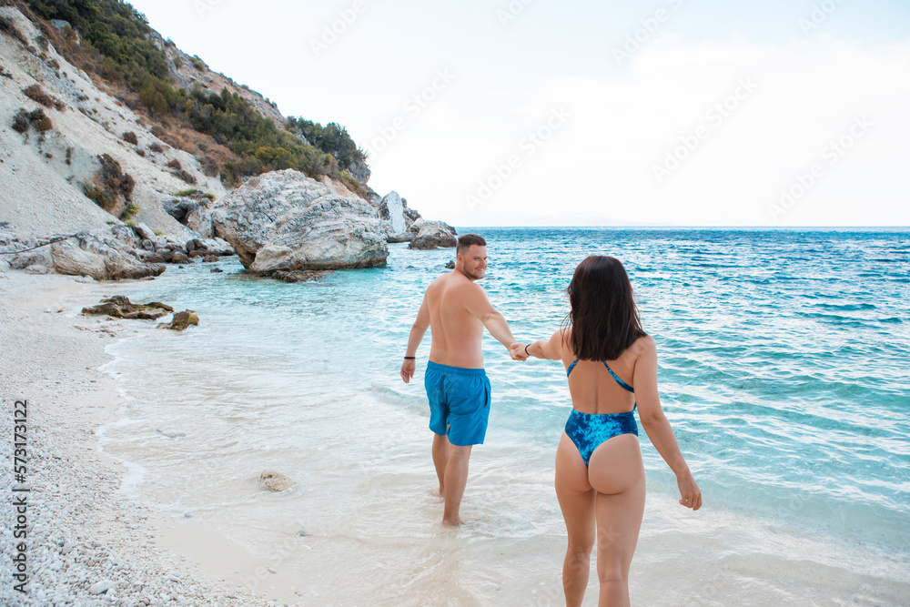 follow me concept couple at sea beach summer vacation follow me concept couple at sea beach summer vacation
