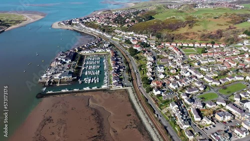 Aerial footage of the town of Deganwy in Conwy County Borough in Wales It lies in the Creuddyn Peninsula alongside Llandudno Rhos-on-Sea showing the Deganwy Marina and railway along the Conwy river photo