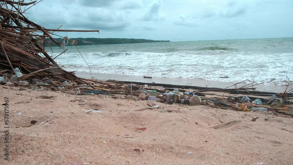 Tropical beach completely covered with garbage and waste. Ecological disaster in Bali island, Jimbaran beach, Indonesia. Global ocean pollution, natural disaster of mankind Tropical beach completely covered with garbage and waste. Ecological disaster in Bali island, Jimbaran beach, Indonesia. Global ocean pollution, natural disaster of mankind