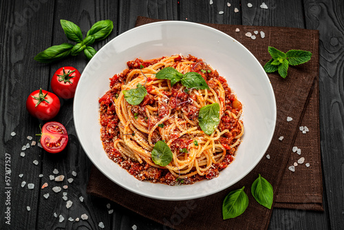 Traditional italian spaghetti bolognese on a dark background