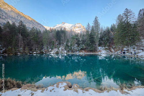 Partial view of the snowy Blausee lake in Switzerland.