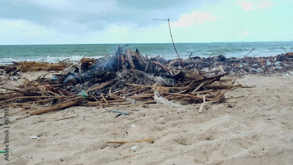 garbage incineration, Tropical beach completely covered with garbage and waste. Ecological disaster in Bali island, Jimbaran beach, Indonesia. Global ocean pollution, natural disaster of mankind garbage incineration, Tropical beach completely covered with garbage and waste. Ecological disaster in Bali island, Jimbaran beach, Indonesia. Global ocean pollution, natural disaster of mankind