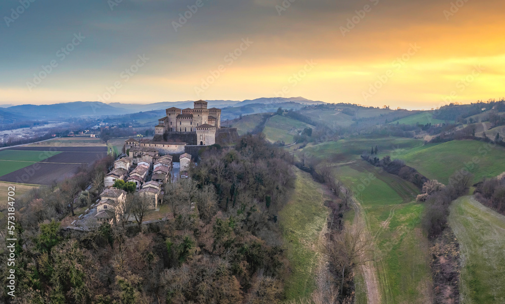 Panoramic aerial view of Torrechiara Castle during winter sunset. Parma, Italy.