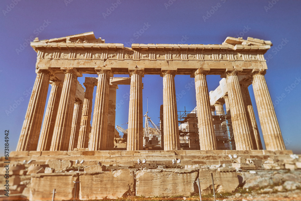 Fototapeta premium Parthenon under clear blue sky, the famous ancient Greek temple on the acropolis of Athens. Cultural travel Greece.
