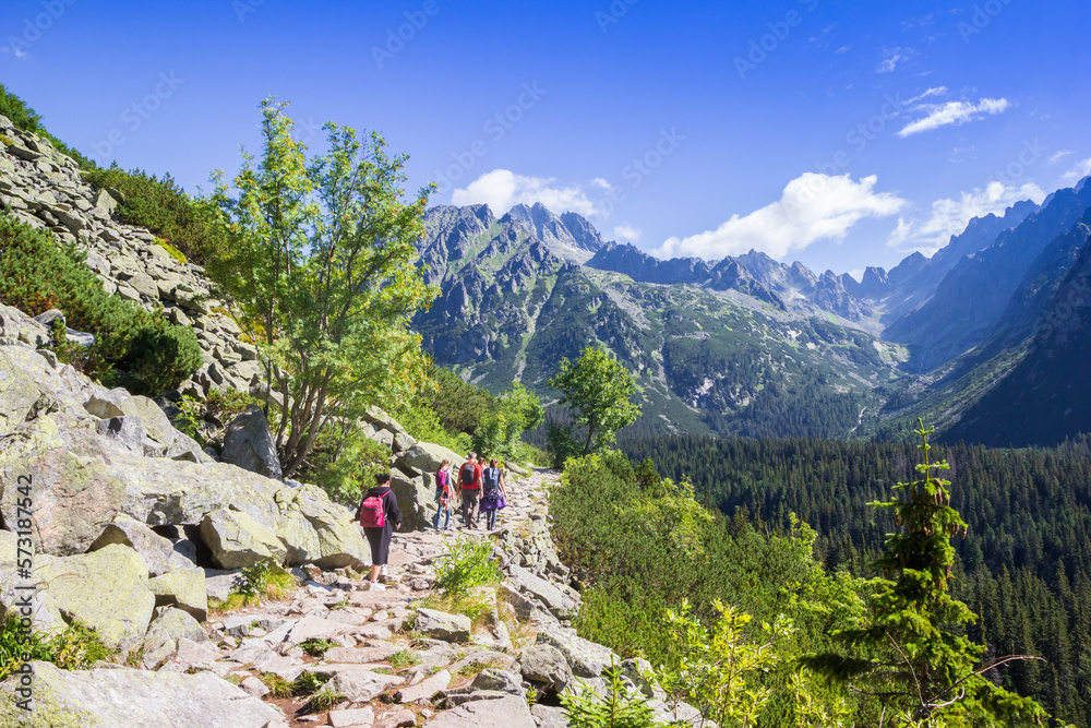 People walking the hiking trail in the Tatra mountains near Popradske Pleso, Slovakia