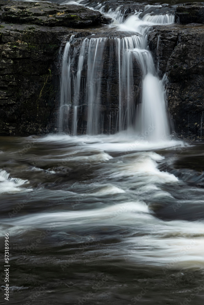 Beautiful dramatic landscape image of Aysgarth Falls in Yorkshire Dales in England during Winter morning
