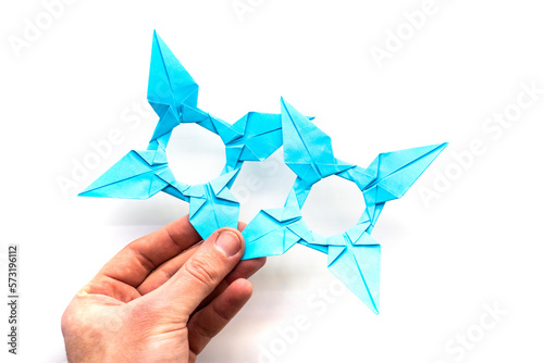 blue paper star on a white background. origami. papercraft. needlework