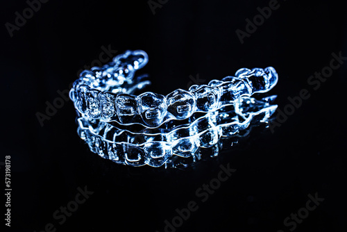 Invisible aligners teeth retainers lie on the mirror