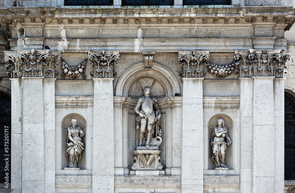 Statues on facade of Basilica Di Santa Maria Della Salute Roman Catholic church in Venice, Italy