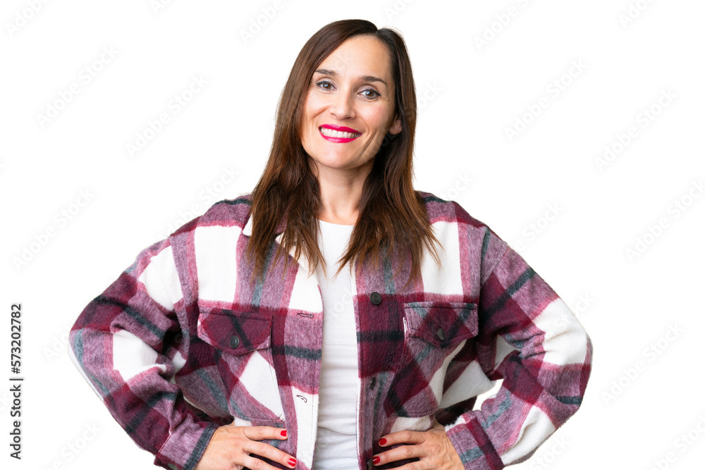 Middle age woman over isolated chroma key background posing with arms at hip and smiling Middle age woman over isolated chroma key background posing with arms at hip and smiling