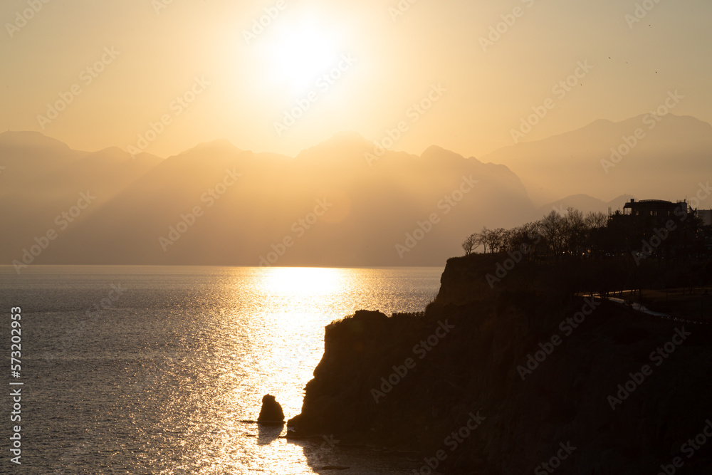 Seascape, mountains and sea at sunset
