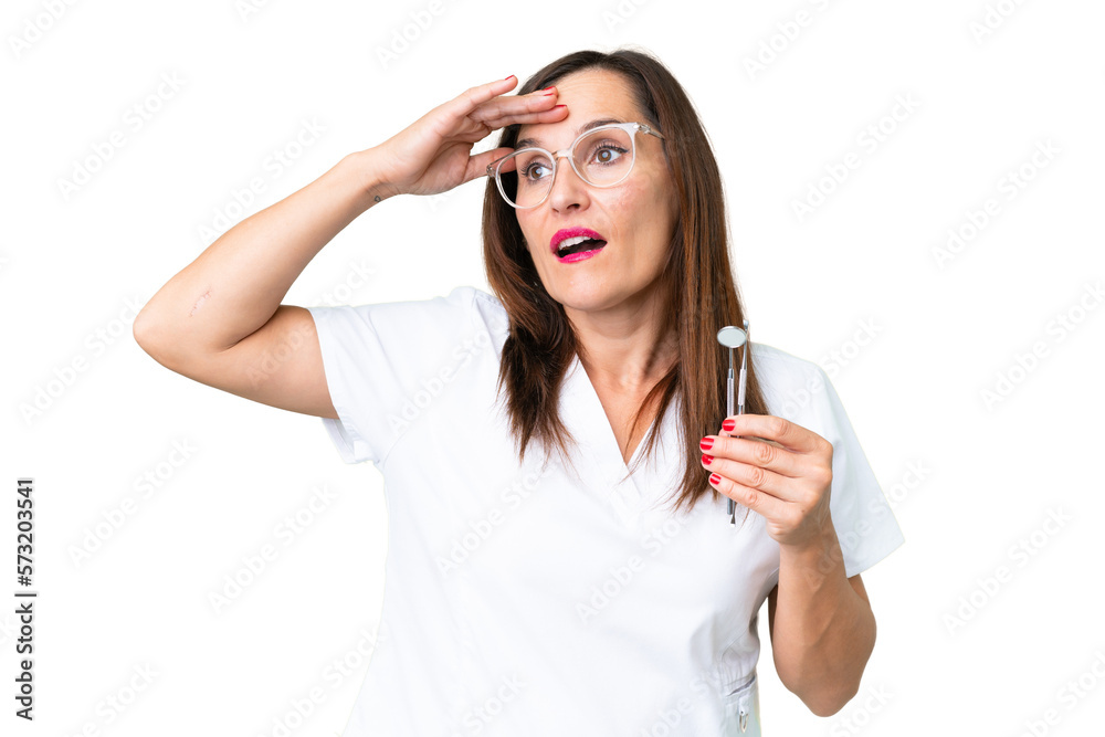 Dentist caucasian woman over isolated chroma key background doing surprise gesture while looking to the side Dentist caucasian woman over isolated chroma key background doing surprise gesture while looking to the side