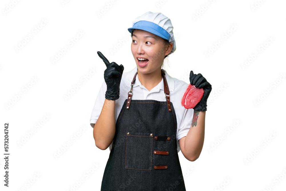 Young caucasian woman wearing an apron and serving fresh cut meat over isolated background intending to realizes the solution while lifting a finger up