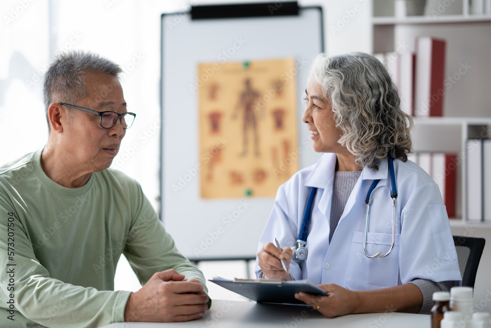 Serious middle-aged female doctor pediatrician talk with male patient, examine and discussing about the illness. Serious middle-aged female doctor pediatrician talk with male patient, examine and discussing about the illness.