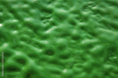 Green wet acrylic paint. Painted abstract background.