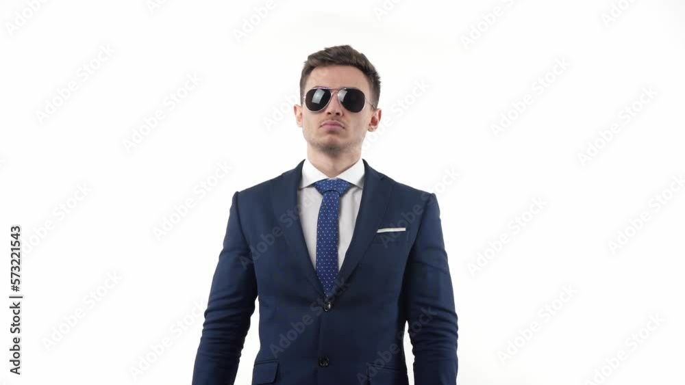 Male businessman in a suit in glasses holds a pineapple in his hand rejoices. The concept of end of the working day, or beginning of vacation corporate joy. Male businessman in a suit in glasses holds a pineapple in his hand rejoices. The concept of end of the working day, or beginning of vacation corporate joy.