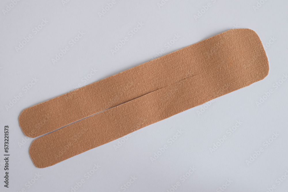 Power of Kinesio Tape for Pain Relief and Improved Mobility. The cut out Sticker is ready to be pasted on the Body. Power of Kinesio Tape for Pain Relief and Improved Mobility. The cut out Sticker is ready to be pasted on the Body.
