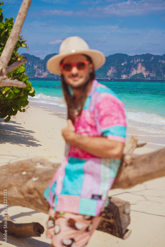 portrait of a man on the beach in krabi thailand with sunglasses, poda island, model shooting 