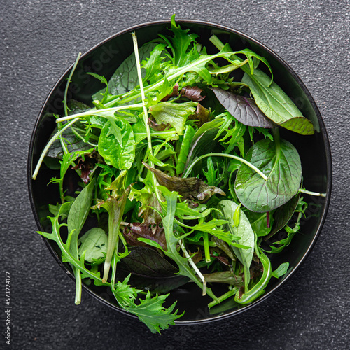 salad mix green leaves mix micro green  juicy healthy snack food on the table copy space food background rustic top view
