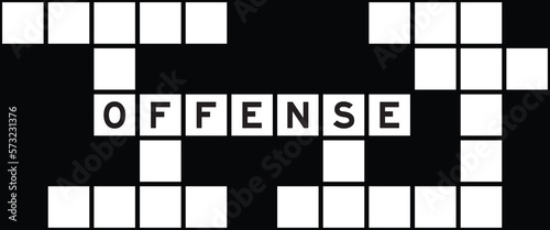 Alphabet letter in word offense on crossword puzzle background
