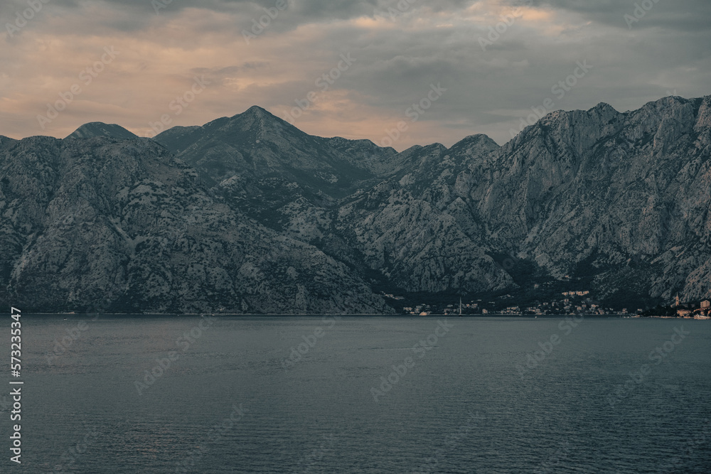 Perfect landscape, view of Kotor bay during sunset, mountains and sea, soft colours, background creative edit