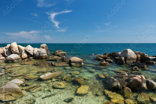 Natural stone arch and turquoise sea and blue sky, Ko Man Klang