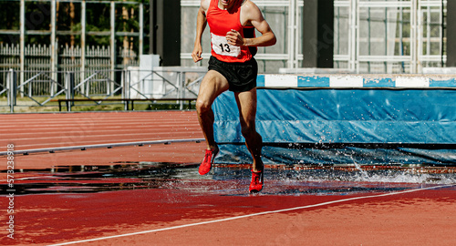 male runner athlete run steeplechase photo