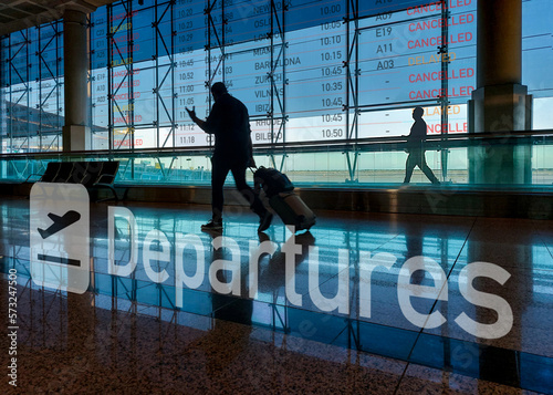 Angry travelers walking to the departure gate. Delay or cancelled flight.   Airlines strike concept