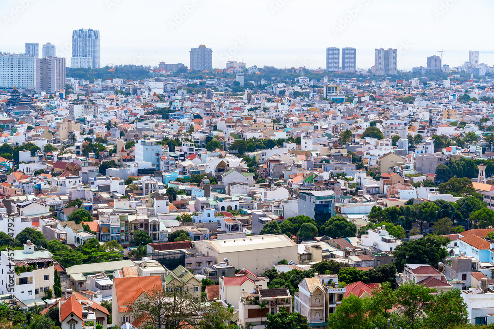 Morning in Vung Tau seen from above, with the most beautiful sea waves, coastline, streets, buidling, coconut trees and Tao Phung mountain in Vietnam. Travel concept. Morning in Vung Tau seen from above, with the most beautiful sea waves, coastline, streets, buidling, coconut trees and Tao Phung mountain in Vietnam. Travel concept.