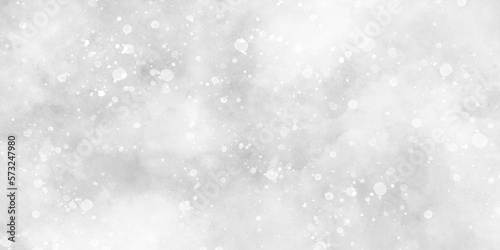 Abstract light blur defocused white background with bokeh, Beautiful winter background of snow floating into air randomly, light grey bokeh background for wallpaper, invitation, cover and design.