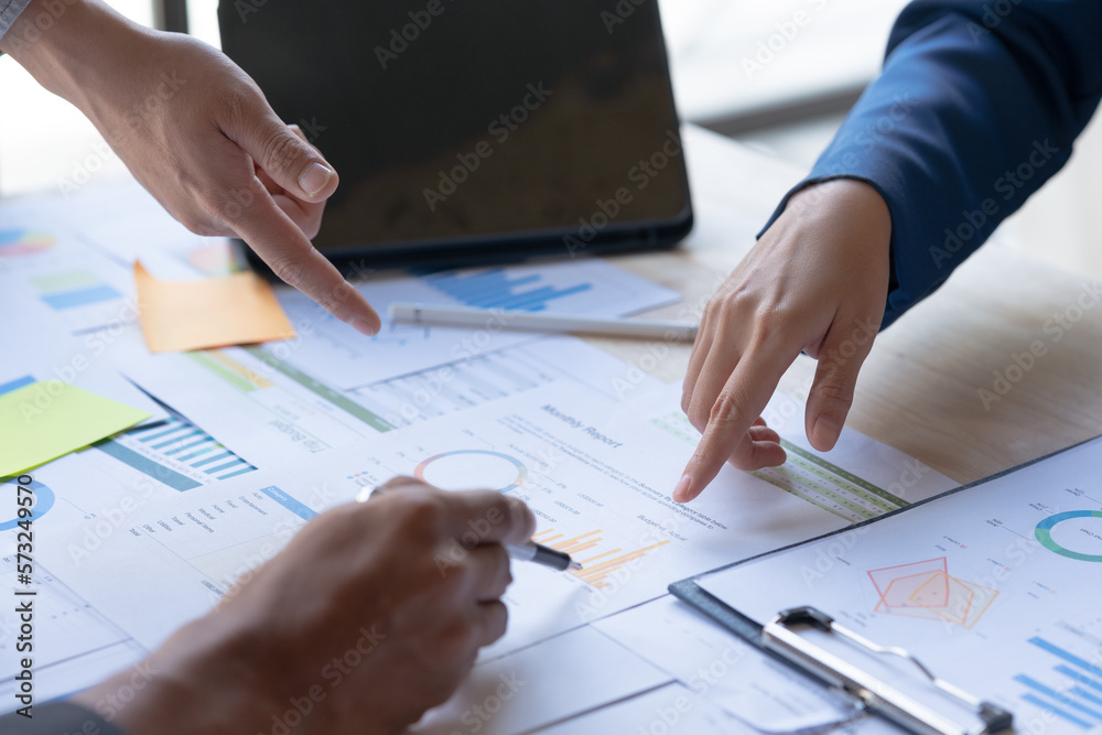 Business people meeting to plan, analyze and point to graph and chart about business growth to plan future expansion of new business. Business people meeting to plan, analyze and point to graph and chart about business growth to plan future expansion of new business.