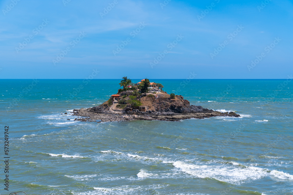 Hon Ba temple (Vietnamese language is Mieu Hon Ba) is a small pagoda in island in Vung Tau City, Vietnam. People walking in rock to visit temple in middle of month. Hon Ba temple (Vietnamese language is Mieu Hon Ba) is a small pagoda in island in Vung Tau City, Vietnam. People walking in rock to visit temple in middle of month.