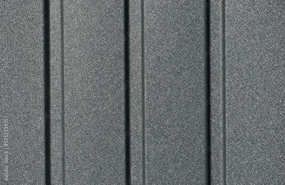 powder coated textured gray metal siding detail. fluted corrugated