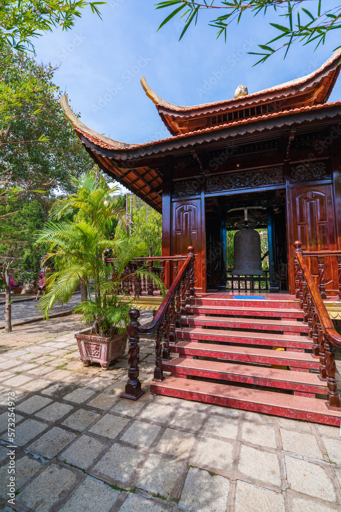 The beautiful morning at the Golden Buddha holding a lotus flower at Chon Khong Monastery attracts tourists to visit on weekends in Vung Tau. Travel concept