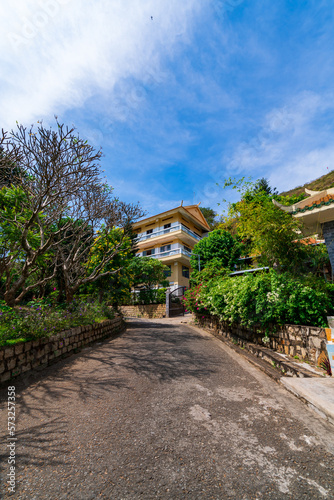 The beautiful morning at the Golden Buddha holding a lotus flower at Chon Khong Monastery attracts tourists to visit on weekends in Vung Tau. Travel concept