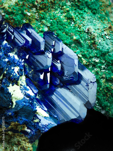 Blue azurite crystal on malachite matrix. macro detail texture background. close-up raw rough unpolished semi-precious gemstone photo