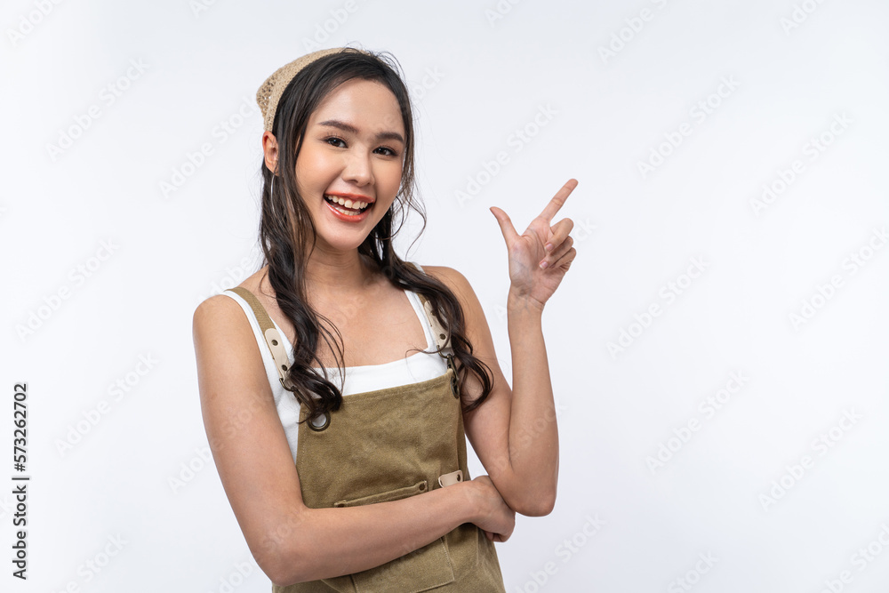 Happy Asian woman is smiling and pointing finger to copy space isolated on white background. Happy Asian woman is smiling and pointing finger to copy space isolated on white background.