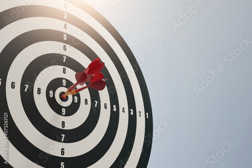 Red dart arrow in the center of dartboard on bullseye business success concept ,3d rendering photo