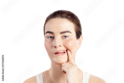 Woman shows a broken tooth. Absence of a tooth. She needs an implant, close up photo white background