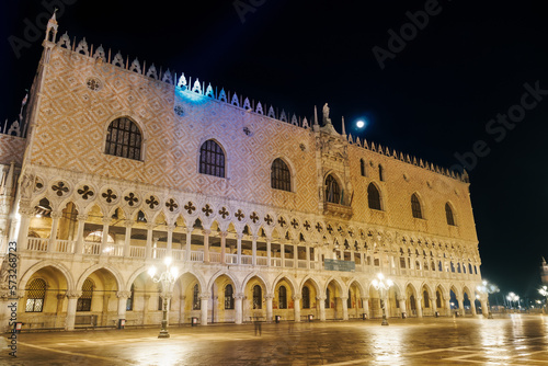 Venice Italy night view of illuminated Palazzo Ducale landmark, 1340 Doges Palace built in Venetian Gothic style at St. Marks square.