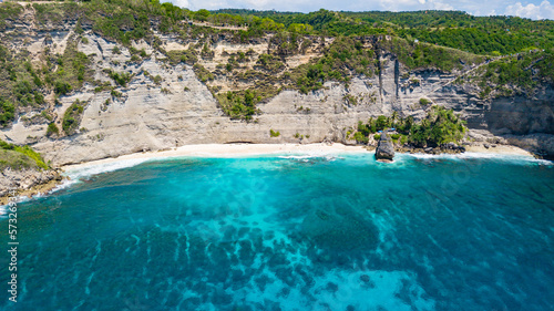 Aerial drone view to beautiful sandy beach (Diamond beach) with rocky mountains and clear water in Nusa Penida, Bali, Indonesia