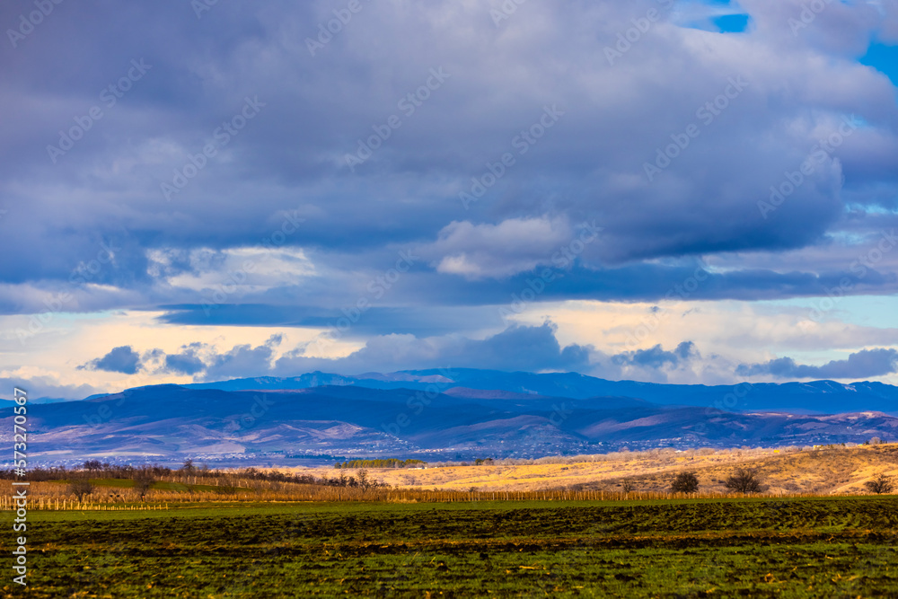 Obraz premium Autumn fall landscape in Kakheti region, Georgia. Beautiful view. Dramatic sky. Mountains in the background.