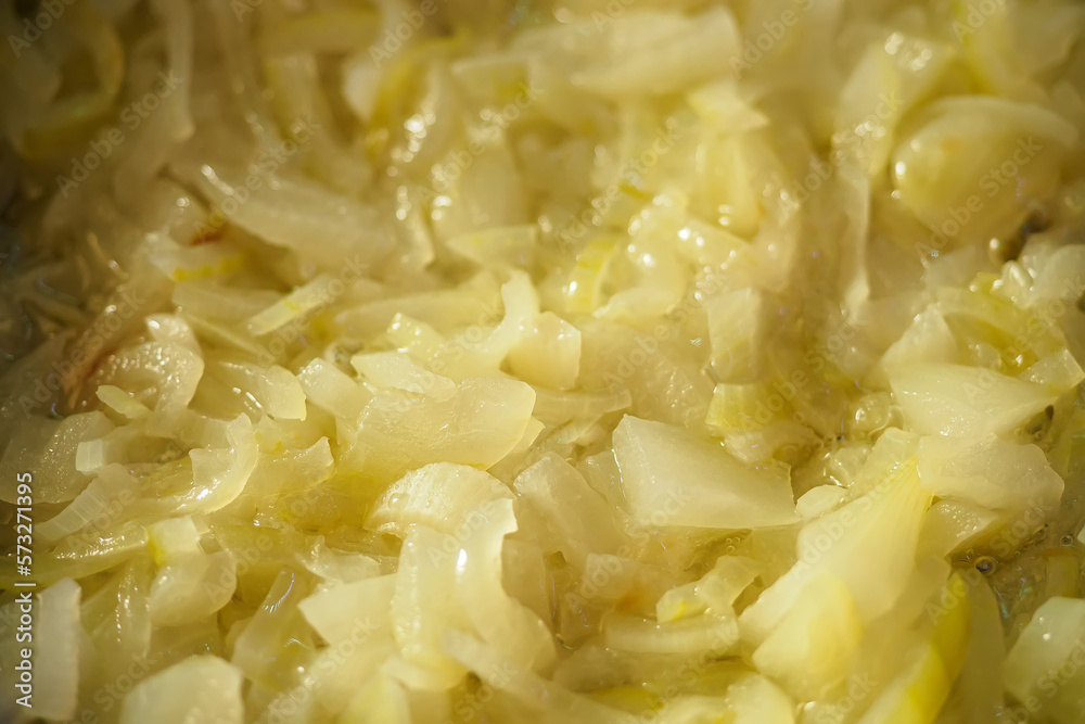 It's fried onions in oil close-up. Stewed vegetables. It's fried onions in oil close-up. Stewed vegetables.