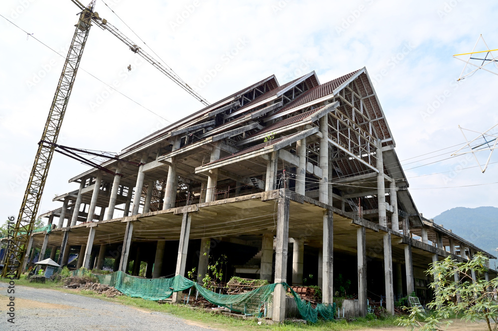 CHANTHABURI, THAILAND - FEBRUARY 19, 2023 : The Pavilion of Thai Buddhist temple Construction has not been completed abandoned for a long time with natural background.