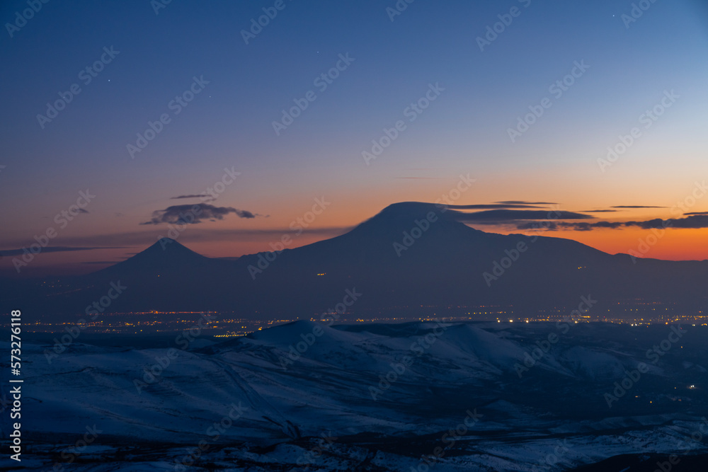 Beautiful landscape after the sunset with starry sky over the mountains. Ararat mountain.