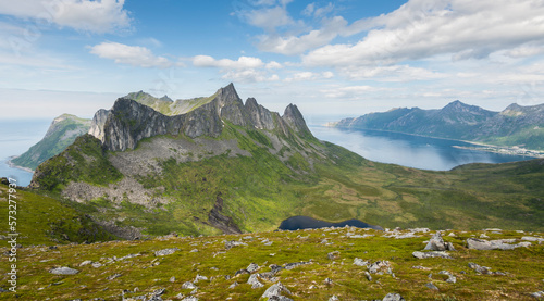 View from Hesten mountain on Senja island with mountain peaks and fjords during summer in Norway photo