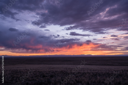 Evening Clouds Glow Pink and Orange Over High Plains of Colorado