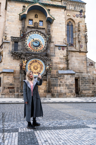 Photography A young female tourist in Prague takes a selfie photo to share online