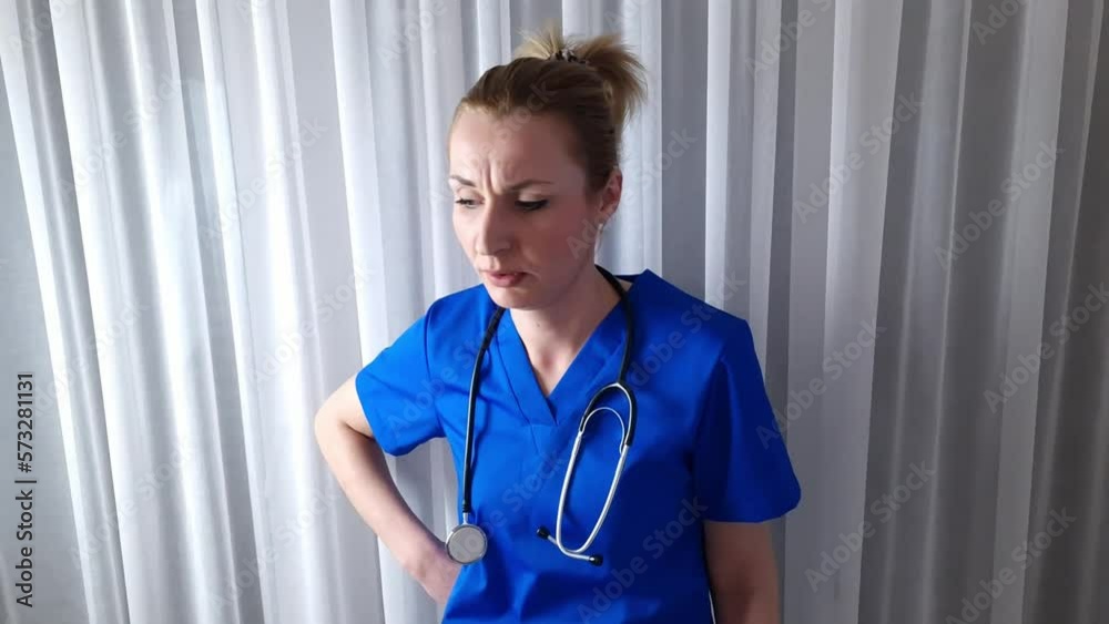 Young nervous disappointed female caucasian doctor speaking and leaving workplace. Medicine and health care concept Young nervous disappointed female caucasian doctor speaking and leaving workplace. Medicine and health care concept